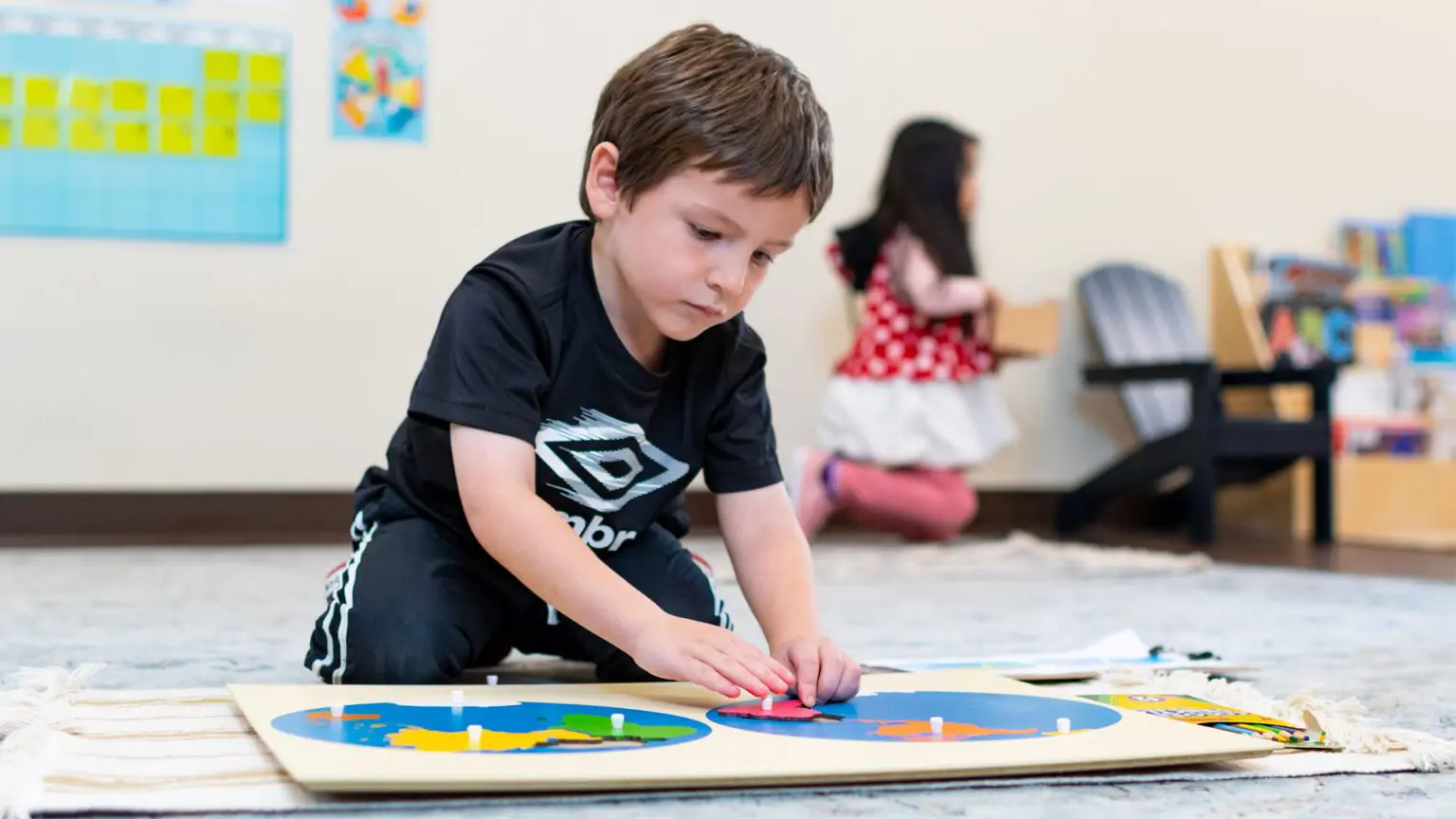 A young boy is playing with a puzzle.