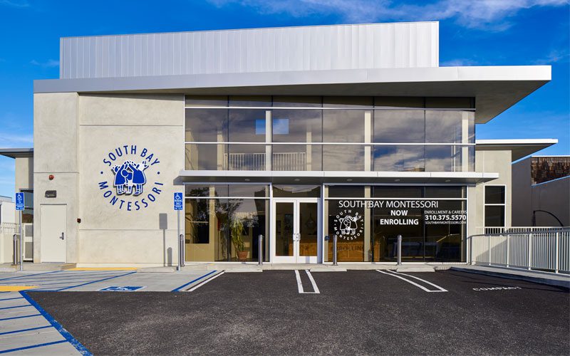 A building with a large window in the middle of it.