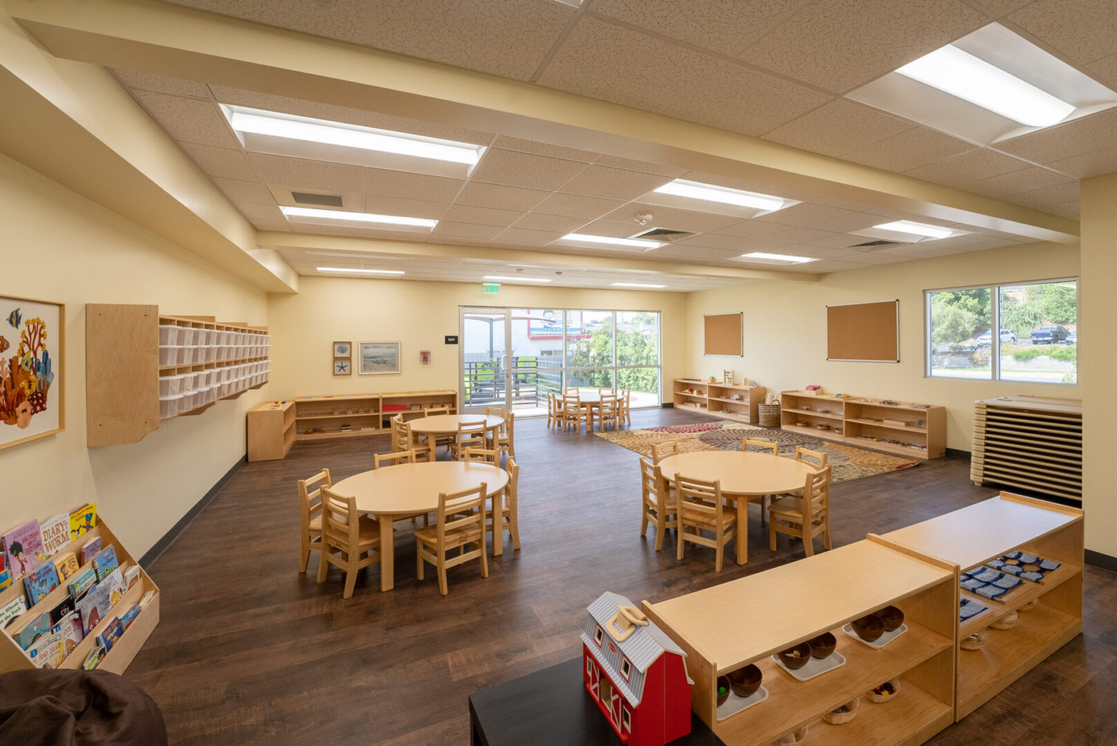 A classroom with tables and chairs in it